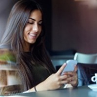 Lady using a smartphone in a coffee shop