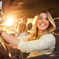 Mom and daughter in a new car
