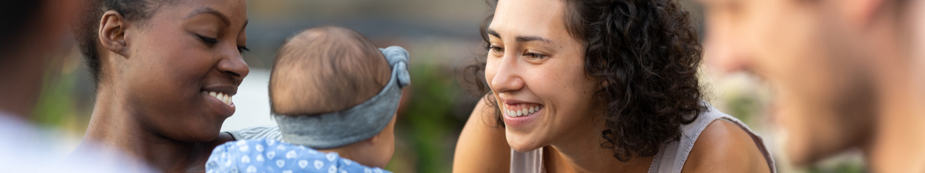 Mom with baby meeting a lady